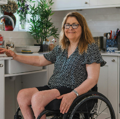woman in wheelchair in kitchen