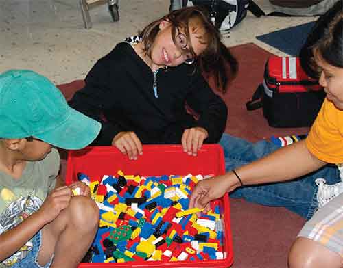 girl playing with building blocks